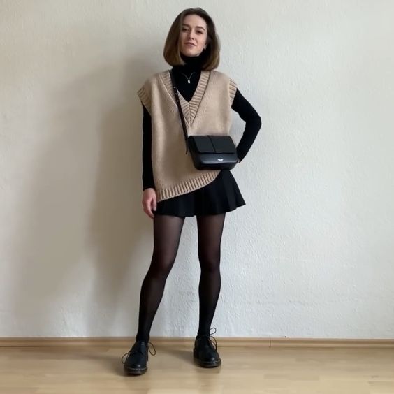 Beige Sweater Vest and Black Skirt